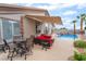 Inviting backyard with a pool, spa, covered patio and ample seating at 8911 Lansberry Ct, Las Vegas, NV 89147