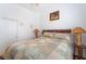 Bedroom with ceiling fan, patterned quilt, and wood furnishings at 8911 Lansberry Ct, Las Vegas, NV 89147