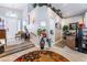 Inviting entryway with wood-look flooring, decorative accents, and a staircase to a higher level at 8911 Lansberry Ct, Las Vegas, NV 89147