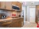 Modern kitchen boasts stainless steel appliances, granite countertops, and decorative backsplash at 8911 Lansberry Ct, Las Vegas, NV 89147