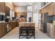 Modern kitchen featuring stainless steel appliances, updated countertops and hardwood cabinetry at 8911 Lansberry Ct, Las Vegas, NV 89147