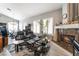 Stylish living room featuring hardwood floors, a fireplace and comfortable seating at 8911 Lansberry Ct, Las Vegas, NV 89147