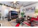 Bright living room with vaulted ceilings, large windows, and modern decor creates an inviting space at 8911 Lansberry Ct, Las Vegas, NV 89147