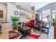 Open living area features a large rug, comfortable seating, and bright natural light from the windows at 8911 Lansberry Ct, Las Vegas, NV 89147