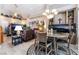 Open-concept living space with built-in shelving, comfortable seating, and contemporary lighting at 8911 Lansberry Ct, Las Vegas, NV 89147