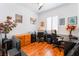 Functional home office with hardwood floors, natural light, and ample desk space for productivity at 8911 Lansberry Ct, Las Vegas, NV 89147