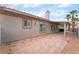Spacious covered patio featuring brick pavers and direct access to the home's interior at 8911 Lansberry Ct, Las Vegas, NV 89147