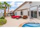 Backyard with a pool, spa, patio furniture, and desert landscaping at 8911 Lansberry Ct, Las Vegas, NV 89147