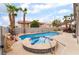 Backyard pool and spa with mature landscaping and sunny skies at 8911 Lansberry Ct, Las Vegas, NV 89147