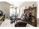 Bright sitting area featuring hardwood floors, lots of natural light and comfortable seating at 8911 Lansberry Ct, Las Vegas, NV 89147
