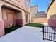 Private backyard with an artificial grass area and a concrete patio, perfect for outdoor entertaining at 8990 Partridge Hill St, Las Vegas, NV 89148