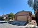 Charming single-Gathering house featuring a two-car garage and well-maintained landscaping at 8990 Partridge Hill St, Las Vegas, NV 89148