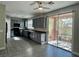 Modern kitchen featuring gray cabinets, granite countertops, and stainless steel appliances at 8990 Partridge Hill St, Las Vegas, NV 89148