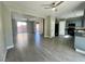 Open-concept layout with gray cabinets, granite countertops, and stainless steel appliances at 8990 Partridge Hill St, Las Vegas, NV 89148