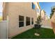 Small and cute, this side yard is nicely landscaped with artificial turf and has a privacy fence at 9019 Winchester Ridge St, Las Vegas, NV 89139