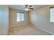 Neutral bedroom with carpet, ceiling fan, and large windows at 9019 Winchester Ridge St, Las Vegas, NV 89139