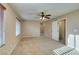 Spacious, neutral bedroom with carpet, ceiling fan and large windows at 9019 Winchester Ridge St, Las Vegas, NV 89139