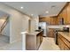 Modern kitchen featuring stainless steel appliances, granite countertops, and lots of natural light at 9019 Winchester Ridge St, Las Vegas, NV 89139