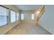 Spacious living room with neutral carpet, natural light, and staircase access to upper level at 9019 Winchester Ridge St, Las Vegas, NV 89139