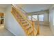 Staircase features wood railing, neutral walls, and plush carpet at 9019 Winchester Ridge St, Las Vegas, NV 89139