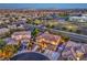 Stunning aerial view of a two-story home with a desert landscape in a well-developed neighborhood at 9805 Turtle Walk Ave, Las Vegas, NV 89149