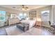 Bright bedroom with a ceiling fan, neutral decor, and ample natural light at 9805 Turtle Walk Ave, Las Vegas, NV 89149