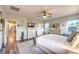Airy bedroom with a ceiling fan, large dresser, and views to the hallway at 9805 Turtle Walk Ave, Las Vegas, NV 89149