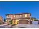 Charming two-story home with a tile roof and well-manicured landscaping at 9805 Turtle Walk Ave, Las Vegas, NV 89149