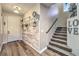 Inviting foyer with stylish decor, wood paneling, and staircase at 9805 Turtle Walk Ave, Las Vegas, NV 89149