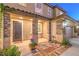 Inviting front porch with stone accents and manicured greenery at 9805 Turtle Walk Ave, Las Vegas, NV 89149