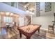 Game room featuring a pool table with an open view to the dining area and second floor at 9805 Turtle Walk Ave, Las Vegas, NV 89149