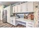 Kitchen features stainless steel appliances, stylish backsplash, built-in desk and plenty of storage space at 9805 Turtle Walk Ave, Las Vegas, NV 89149
