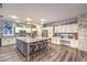 Spacious kitchen features a large island, custom cabinets, and stainless steel appliances at 9805 Turtle Walk Ave, Las Vegas, NV 89149