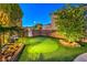 Private putting green for leisure and practice at 9805 Turtle Walk Ave, Las Vegas, NV 89149