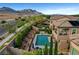 A stunning aerial shot of a home featuring a backyard with a pool, spa, and landscaped grounds at , Las Vegas, NV 89138