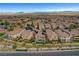 An expansive aerial view showcases a densely populated residential community under a clear sky at , Las Vegas, NV 89138