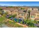 Aerial view of a home with a pool, hot tub, patio area, and lush landscaping in a well-maintained neighborhood at , Las Vegas, NV 89138