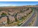 A sprawling community featuring well-maintained homes, mature trees, and wide streets under a clear sky at , Las Vegas, NV 89138