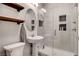 Modern bathroom with a glass shower, a vessel sink, and decorative floating shelves at , Las Vegas, NV 89138