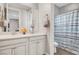 Bright bathroom with double vanity, framed mirror, and separate toilet/shower room at , Las Vegas, NV 89138