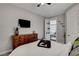 A serene bedroom featuring soft, neutral tones and an open doorway to another room at , Las Vegas, NV 89138