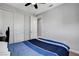 Spacious bedroom with neutral walls, plush carpet, and a large closet featuring a ceiling fan for added comfort at , Las Vegas, NV 89138
