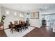 Elegant dining room featuring a wooden table set for six, hardwood floors, and stylish decor at , Las Vegas, NV 89138