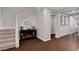 Inviting hallway with hardwood flooring, decorative accents, and a view of the staircase at , Las Vegas, NV 89138
