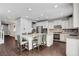 Modern kitchen with large center island, stainless steel appliances, and bright white cabinetry at , Las Vegas, NV 89138