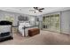 Expansive main bedroom features a tray ceiling, carpet flooring, and a private patio entrance at , Las Vegas, NV 89138
