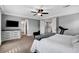 Bright main bedroom with ceiling fan, large windows, and an exercise machine for a personal workout area at , Las Vegas, NV 89138