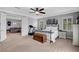 Spacious main bedroom with adjoining living area, ceiling fan, and an exercise machine for a fitness space at , Las Vegas, NV 89138