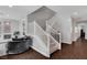 Elegant staircase with white railing, leading to the upper level with stylish living area at , Las Vegas, NV 89138