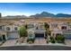 Charming two-story stucco home with a two-car garage, brick driveway and mountain views at , Las Vegas, NV 89138